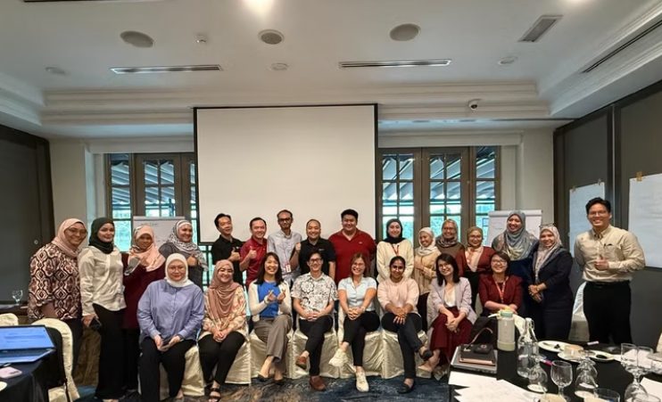 Large group photograph of a completed workshop cohort
